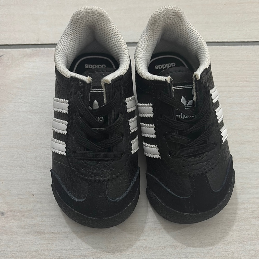 Adidas Black and White Sneakers with Iconic Stripes